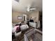 Bedroom with a ceiling fan, white furniture, and bright natural light at 7524 Midnight Rambler St, Las Vegas, NV 89149