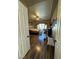 Bright bedroom with a ceiling fan, wood flooring, natural light, and a sliding glass door to the backyard at 7524 Midnight Rambler St, Las Vegas, NV 89149