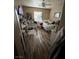 Bedroom with laminate floors, a white metal frame bed, and bright natural light at 7524 Midnight Rambler St, Las Vegas, NV 89149