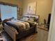 Bedroom featuring a queen-sized bed with neutral tones, a window, and matching nightstands at 7524 Midnight Rambler St, Las Vegas, NV 89149