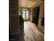 Bright foyer with hardwood floors, decorative glass doors, and ample natural light creating a welcoming space at 7524 Midnight Rambler St, Las Vegas, NV 89149