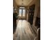Bright foyer with hardwood floors, decorative glass doors, and ample natural light creating a welcoming space at 7524 Midnight Rambler St, Las Vegas, NV 89149