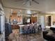 Spacious kitchen with a large island, wooden cabinets, and hardwood floors at 7524 Midnight Rambler St, Las Vegas, NV 89149
