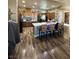 Bright kitchen with wooden cabinets, large island, and hardwood floors at 7524 Midnight Rambler St, Las Vegas, NV 89149