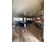 Bright, open living room with pool table, comfortable sofa, and modern kitchen island, perfect for gatherings at 7524 Midnight Rambler St, Las Vegas, NV 89149