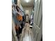 Neatly organized walk-in closet with shelving and hanging space, providing plenty of room for clothes and storage at 7524 Midnight Rambler St, Las Vegas, NV 89149