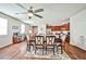 Inviting open-concept dining area with wood floors and access to the kitchen at 766 Topocoba St, Las Vegas, NV 89178