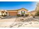 Charming single-story home with a two-car garage and desert landscaping at 766 Topocoba St, Las Vegas, NV 89178