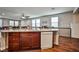 Open concept kitchen with modern appliances and sleek countertops overlooking the living area at 766 Topocoba St, Las Vegas, NV 89178