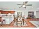 Spacious living and dining area connected to a kitchen with an island at 766 Topocoba St, Las Vegas, NV 89178