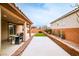 Covered patio perfect for outdoor dining, featuring a grill and adjacent to the low maintenance backyard at 766 Topocoba St, Las Vegas, NV 89178