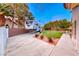 Spacious backyard featuring parking space for recreational vehicle and lush lawn at 7670 Descanso Ln, Las Vegas, NV 89123