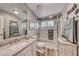 Charming bathroom features granite counters, shower with glass door, and decorative accents at 7670 Descanso Ln, Las Vegas, NV 89123