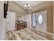 Welcoming entryway showcasing wood-look floors, decorative accents, and ample natural light at 7670 Descanso Ln, Las Vegas, NV 89123