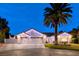 Beautiful single-story home featuring a three-car garage and meticulously landscaped front yard at 7670 Descanso Ln, Las Vegas, NV 89123