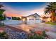 Spacious home with RV parking, featuring a three-car garage, and a beautiful desert landscape at 7670 Descanso Ln, Las Vegas, NV 89123