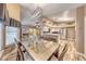 Bright living room featuring a dining table with seating and modern decor in neutral tones at 7670 Descanso Ln, Las Vegas, NV 89123