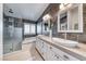 Modern main bathroom with dual sinks, soaking tub, and glass-enclosed shower at 7670 Descanso Ln, Las Vegas, NV 89123