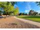 Scenic view of park featuring grassy area, trees, and walking paths at 7670 Descanso Ln, Las Vegas, NV 89123