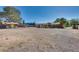 Large backyard with a shed, mature trees, and plenty of room for outdoor activities at 7950 Red Barn Dr, Las Vegas, NV 89123
