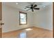 Bedroom with light hardwood floors and a single window at 7950 Red Barn Dr, Las Vegas, NV 89123