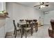 Dining area with seating for six, adjacent to the living area and kitchen at 7950 Red Barn Dr, Las Vegas, NV 89123