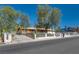 Charming property featuring mature trees, a gated fence, and a welcoming front exterior at 7950 Red Barn Dr, Las Vegas, NV 89123