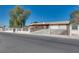 Attractive single-story home with a gated fence and two-car garage at 7950 Red Barn Dr, Las Vegas, NV 89123