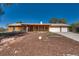 Charming single-story home with a covered porch, well-maintained landscaping, and a two-car garage at 7950 Red Barn Dr, Las Vegas, NV 89123