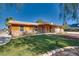 Charming single-story home with a green lawn and a covered porch at 7950 Red Barn Dr, Las Vegas, NV 89123