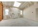 Unfinished interior space with a skylight, door, and two windows, awaiting customization at 7950 Red Barn Dr, Las Vegas, NV 89123