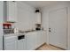Bright kitchen area featuring white cabinets, sink, and stainless steel appliances at 7950 Red Barn Dr, Las Vegas, NV 89123