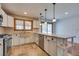 Kitchen features stainless steel appliances, farm sink, and bright countertops at 7950 Red Barn Dr, Las Vegas, NV 89123