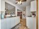 Spacious kitchen area featuring marble countertops, stainless steel sink, and white cabinetry at 7950 Red Barn Dr, Las Vegas, NV 89123