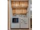 A modern laundry room with matching washer and dryer and built in cabinets at 7950 Red Barn Dr, Las Vegas, NV 89123
