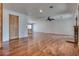 Spacious living room featuring wood floors, natural lighting, and a fireplace at 7950 Red Barn Dr, Las Vegas, NV 89123