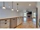 Kitchen island view to open floor plan with living room and fireplace at 7950 Red Barn Dr, Las Vegas, NV 89123