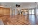 Open-concept living space with wood floors, stainless appliances, and ample natural light at 7950 Red Barn Dr, Las Vegas, NV 89123