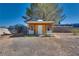 Outdoor shed with double doors and a bench, providing extra storage space and functionality at 7950 Red Barn Dr, Las Vegas, NV 89123