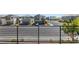 This balcony has black railings and a neighborhood street view at 7983 Texas Hills St, Las Vegas, NV 89113