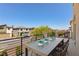 Enjoy neighborhood views from this balcony with table and chair seating at 7983 Texas Hills St, Las Vegas, NV 89113