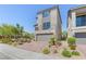 Charming two-story home features a spacious garage and beautifully landscaped front yard at 7983 Texas Hills St, Las Vegas, NV 89113