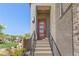 Close-up of the modern front door with a sleek design and stylish hardware on a stone wall at 7983 Texas Hills St, Las Vegas, NV 89113
