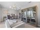 Comfortable living room with decorative lighting, sofa, desk, and built-in display cabinets at 7983 Texas Hills St, Las Vegas, NV 89113