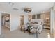 This main bedroom features neutral tones, wood accent wall, walk-in shower, and decor creating a serene retreat at 7983 Texas Hills St, Las Vegas, NV 89113