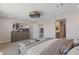 Spacious main bedroom with a dresser, large window, and a view to an ensuite bath and staircase at 7983 Texas Hills St, Las Vegas, NV 89113