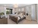 Cozy bedroom with large window, patterned wallpaper, and matching lamps on the nightstands at 7983 Texas Hills St, Las Vegas, NV 89113
