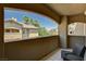 Relaxing balcony with patio furniture, offering scenic views of the community and lush greenery at 8717 Red Brook Dr # 201, Las Vegas, NV 89128