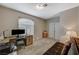 Neutral bedroom featuring a desk, large window, and carpet flooring at 8717 Red Brook Dr # 201, Las Vegas, NV 89128
