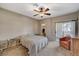 Bedroom featuring a ceiling fan, a slider to the outside and carpet flooring at 8717 Red Brook Dr # 201, Las Vegas, NV 89128
